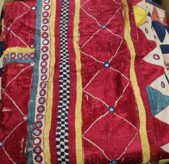 A collection of 19th century Indian silk embroidered and woven textiles